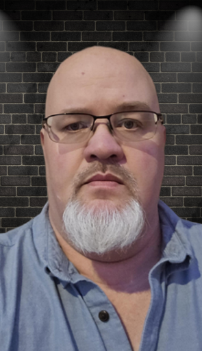 headshot pic of John Simpson